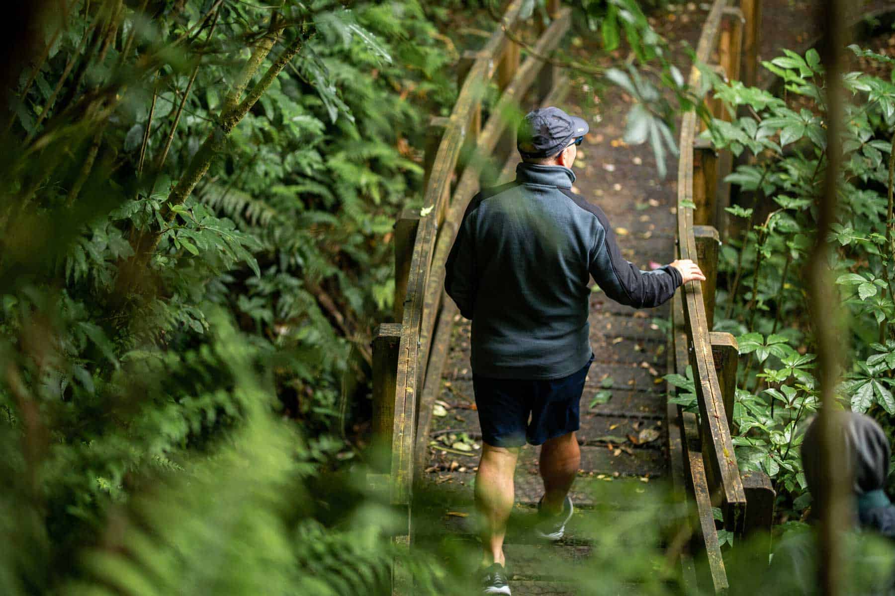 A man walking a guided path through open country