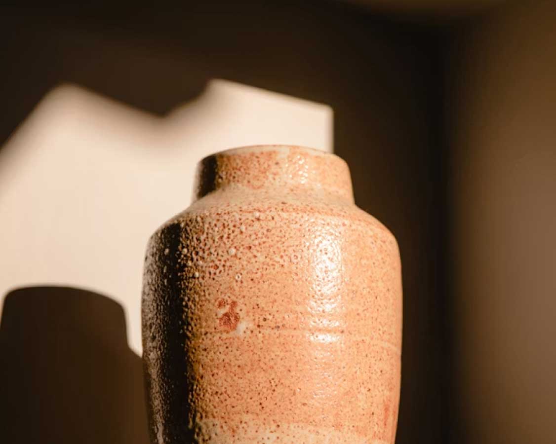 A ceramic urn in soft light